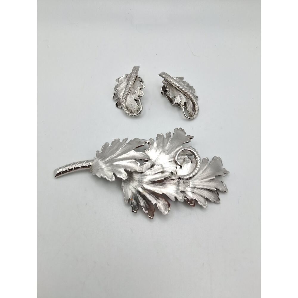 32.  Whiting and Davis brooch and clip on earrings